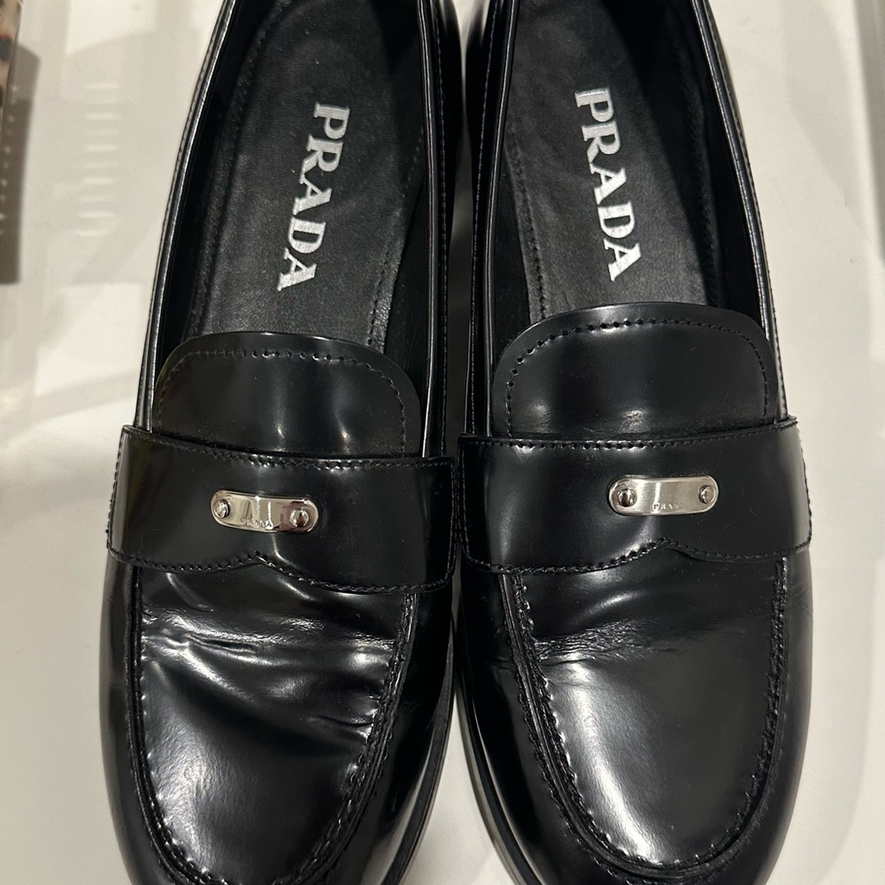 Prada Woman’s Glossy Black Slip-On Loafers